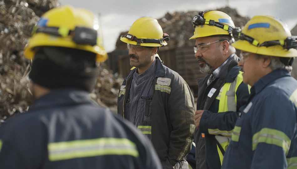 Radius Recycling leadership team discussing operations at facility