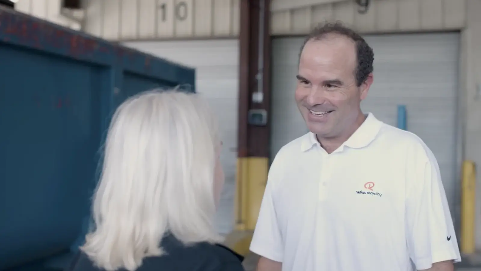 Radius Recycling professionals discussing safe and responsible operation