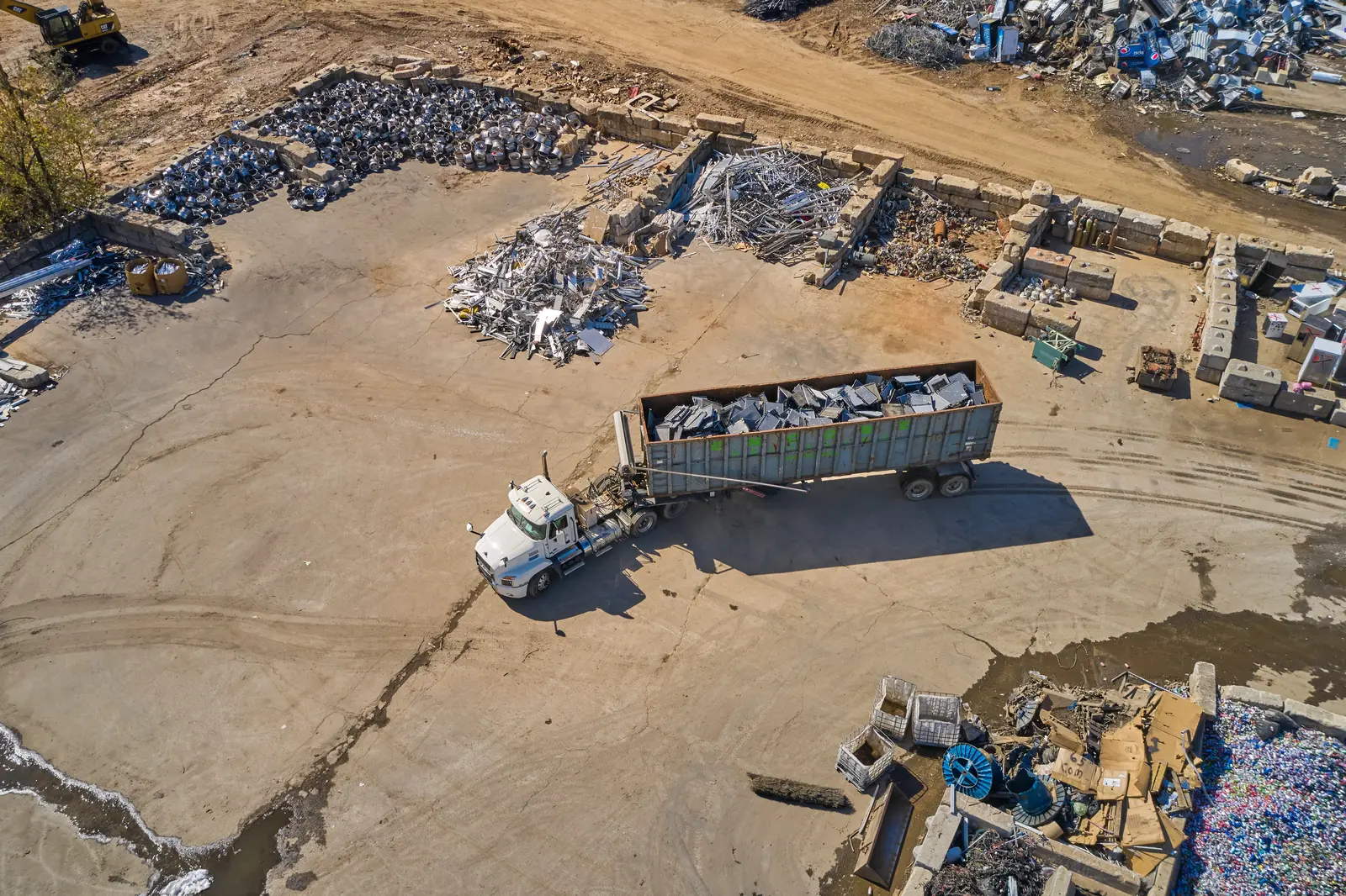 truck hauling light iron scrap to a metal recycling facility