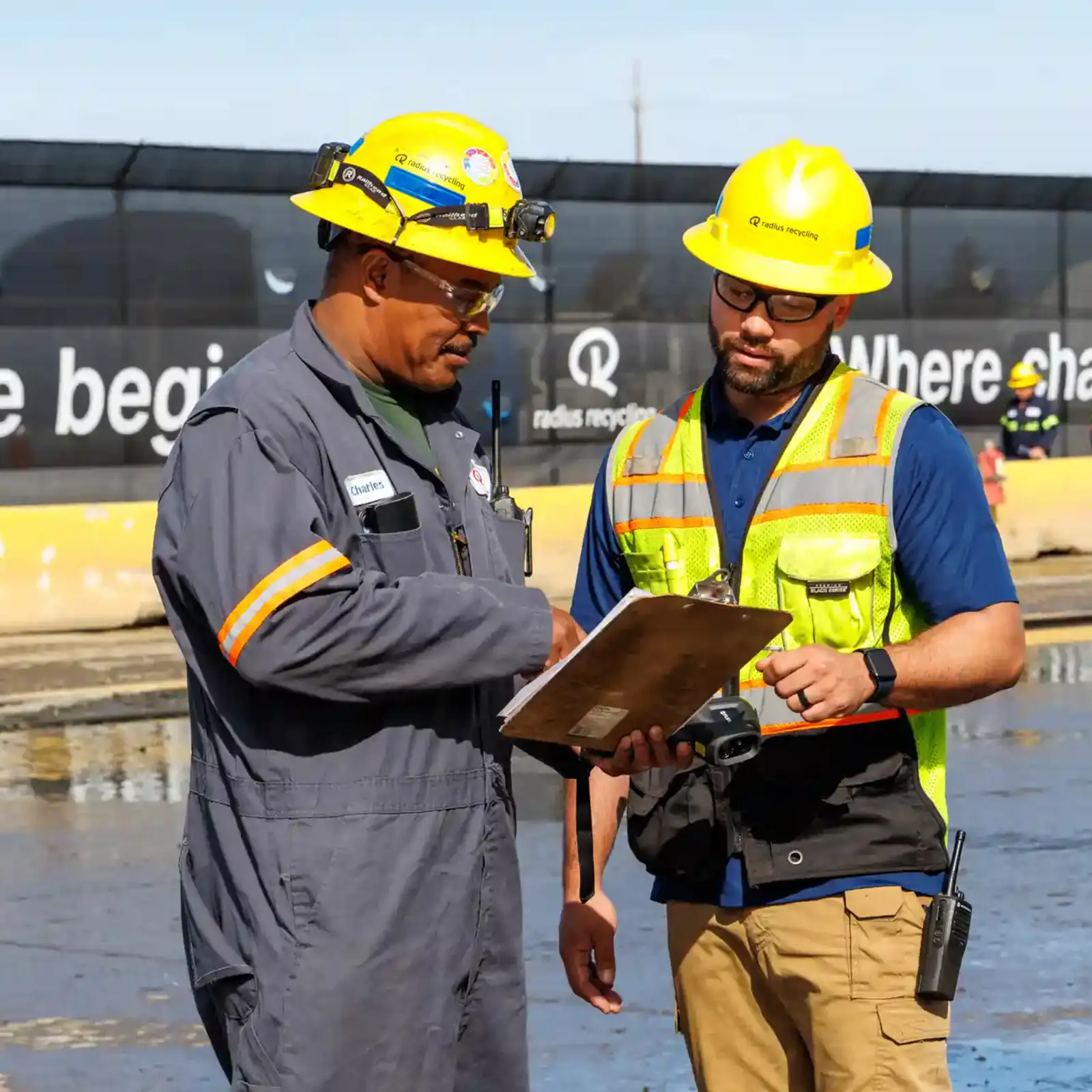 Sell scrap metal to Radius Recycling Radius Recycling team reviewing scrap metal purchase details