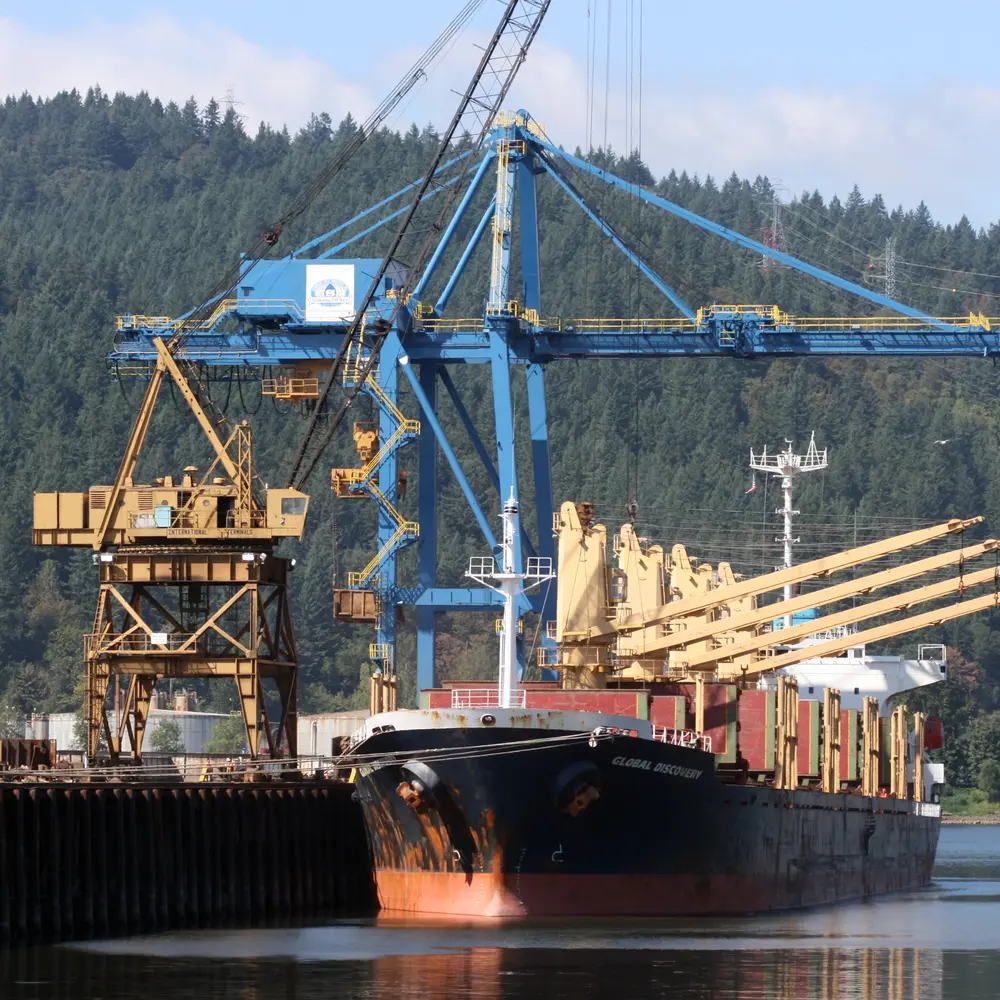 Cargo ship loading scrap metal for global ferrous and nonferrous markets