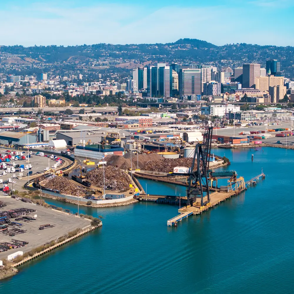 Stacked crushed scrap vehicles prepared for recycling